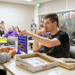 Participant playing a game at game night