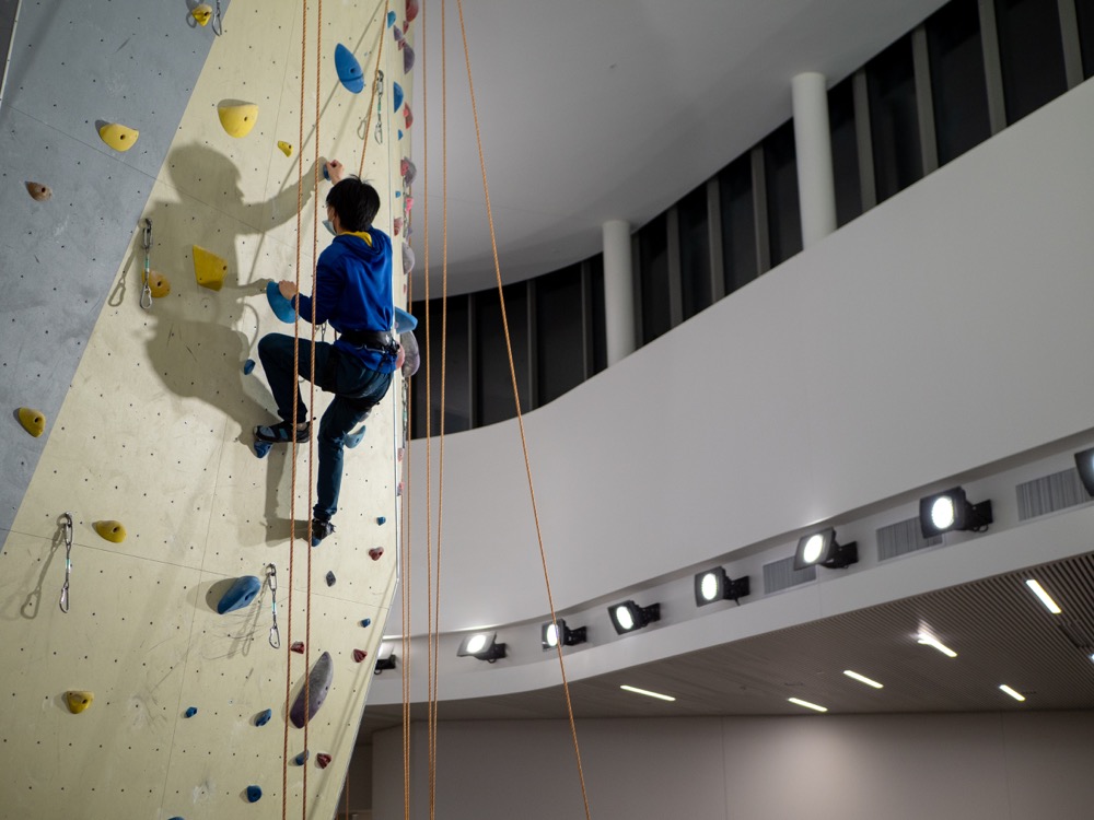 Participant climbing up the Climbing Wall