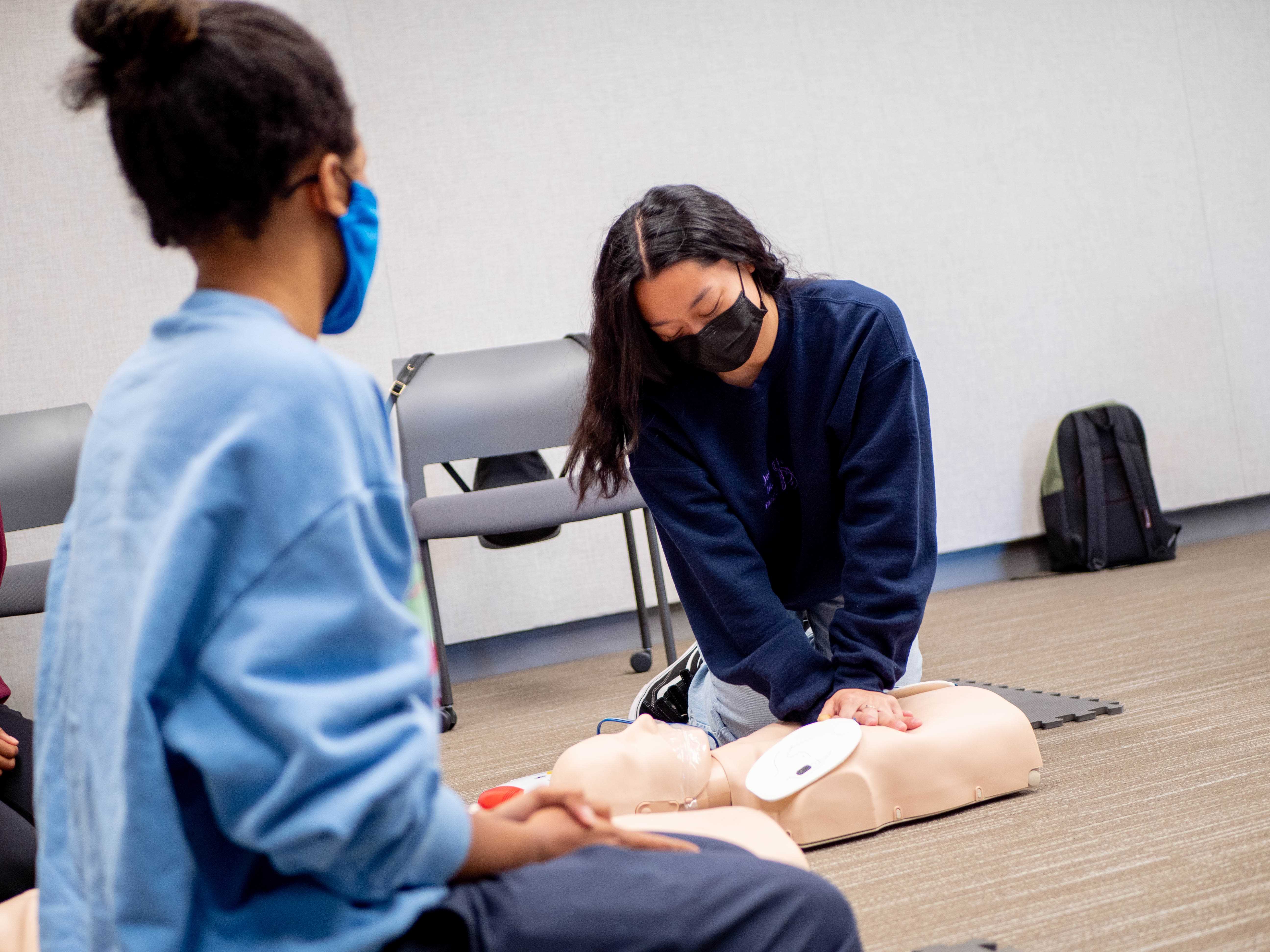 Participant administering first aid