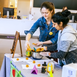 Two instructors teaching a cooking class